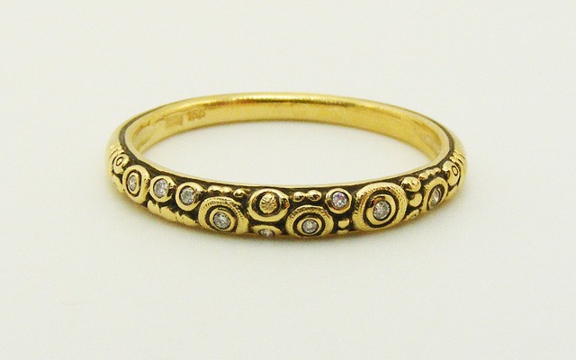 R168
18K yellow gold and diamond ring, 9 diamonds totaling 0.05 ct.
Immediately available in size 7 ½.
$1,630
