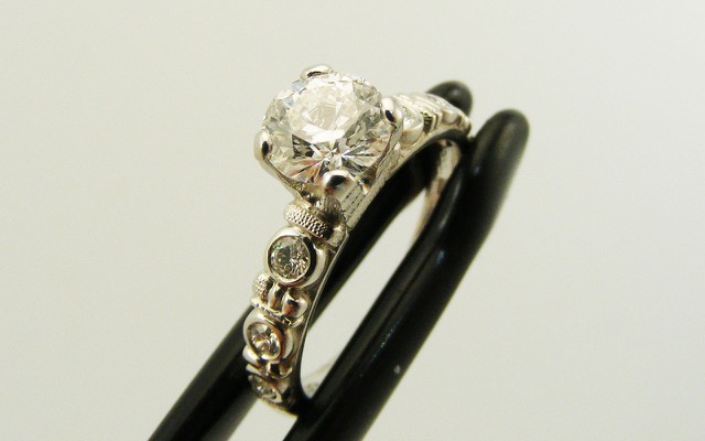 R-166P
“Circle” diamond ring, Platinum, 0.80 ct diamond center (D/SI, GIA certified), 6 side diamonds totaling 0.15 ct. 
Available for immediate delivery in finger size 7
$10,500.00
