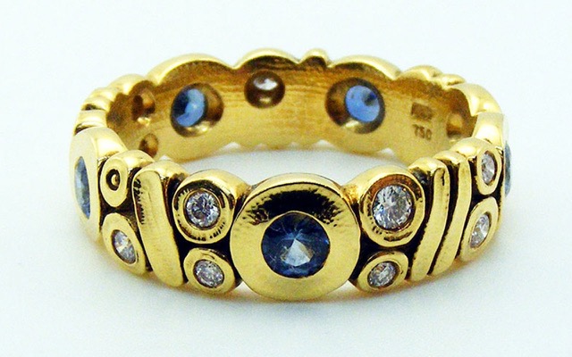 R45F
Blue sapphire & diamond ring, 18K yellow gold, 5.5mm. Five (5) blue sapphires totaling 0.65 ct  and 12-13 diamonds totaling approximately 0.25 ct. 
Available for immediate delivery in finger size 7. 
$4,895.00
