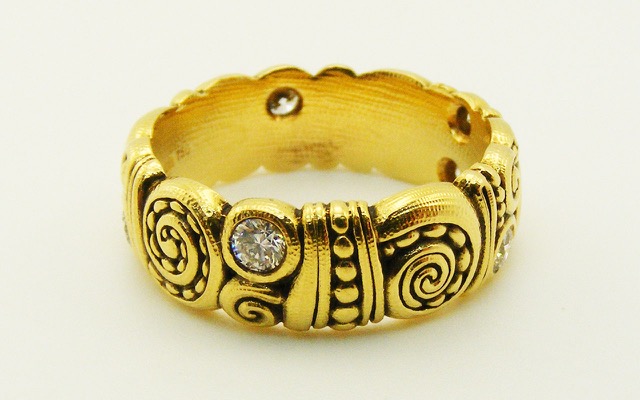 R-80
“Nautilus” diamond ring, 18K yellow gold, 6.5 mm wide. Seven diamonds totaling 0.30 ct.
Available for immediate delivery in finger size 6. 
$3,940.00
