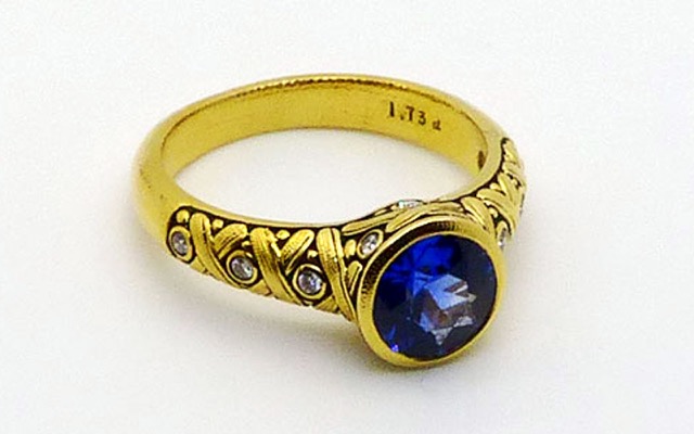 R-80M
“Criss Cross” blue sapphire ring, 18K yellow gold, 1.73 ct blue sapphire, 12 diamonds totaling 0.15 ct total. Available for immediate delivery in finger size 6 ½ 
$7,875.00

