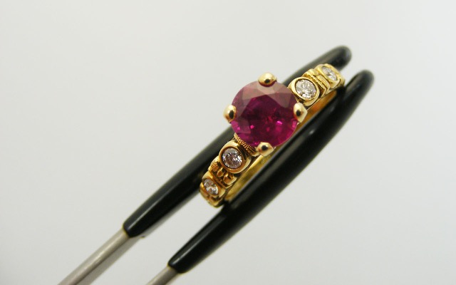 R-166M
“Circle” ruby ring, 18K yellow gold, 1.07 ct Ruby, 6 diamonds of 0.15 ct total. 
Available for immediate delivery in finger size 5 ¾ 
$5,430.00
