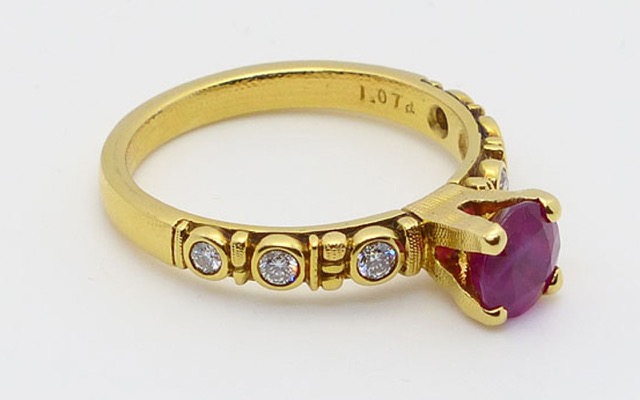 R-166M
“Circle” ruby ring, 18K yellow gold, 1.07 ct Ruby, 6 diamonds of 0.15 ct total. 
Available for immediate delivery in finger size 5 ¾ 
$5,430.00
