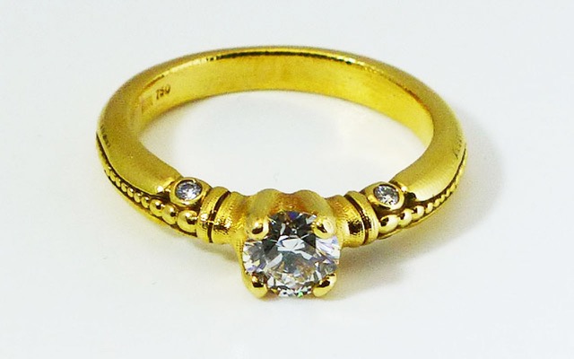R-52M 
“Bubbles” diamond ring, 18K yellow gold,  0.59 ct diamond center (E/SI/IP), 4 side diamonds totaling  0.05 ct. 
 Available for immediate delivery in finger size 6 ½  
$5,965.00 
