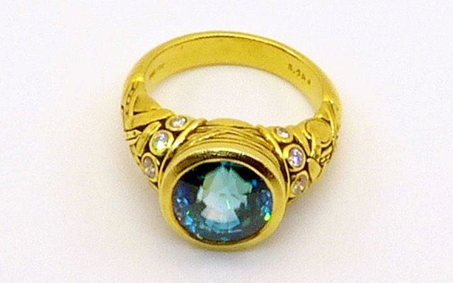 R-58M
“Reed” blue zircon ring, 18K yellow gold, 8.40 ct blue zircon center gemstone, 10 diamonds of  0.28 ct total. 
$9,610.00
Available for immediate delivery in finger size 6 ¾. 
