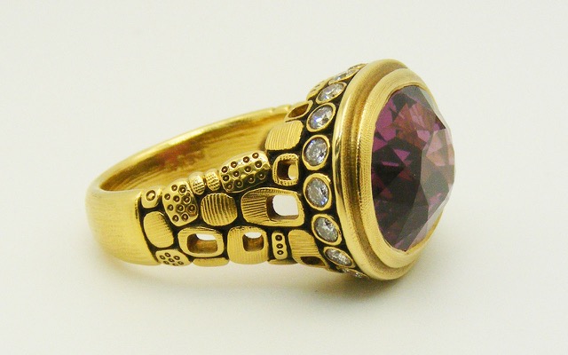 R-90M
“Little Windows” garnet ring, 18K yellow gold,  8.83 ct Garnet center gemstone, 20 side diamonds totaling 0.40ctw.  
Available for immediate delivery in finger size 6 
$7,225.00
