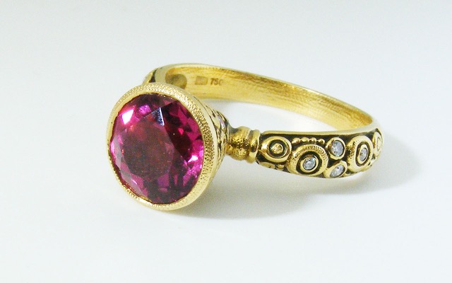 R128
“Martini” ring in 18K yellow gold with a 2.22 cts rubellite tourmaline and 17 diamonds totaling 0.20 ct.
Available for immediate delivery in finger size 6 ¾. 
$4,135.00
