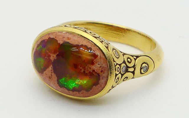 R-134 
“Circle Set” ring in 18K yellow gold with a stunning 5.87 ct Mexican boulder opal and 14 diamonds totaling 0.20 ct. Available for immediate delivery in finger size 7.
$5,790
