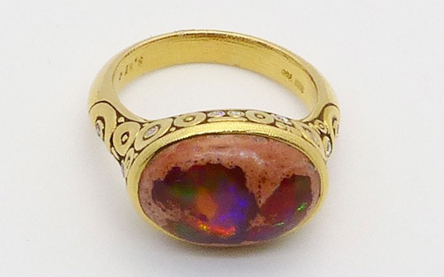 R-134 
“Circle Set” ring in 18K yellow gold with a stunning 5.87 ct Mexican boulder opal and 14 diamonds totaling 0.20 ct. Available for immediate delivery in finger size 7.
$5,790
