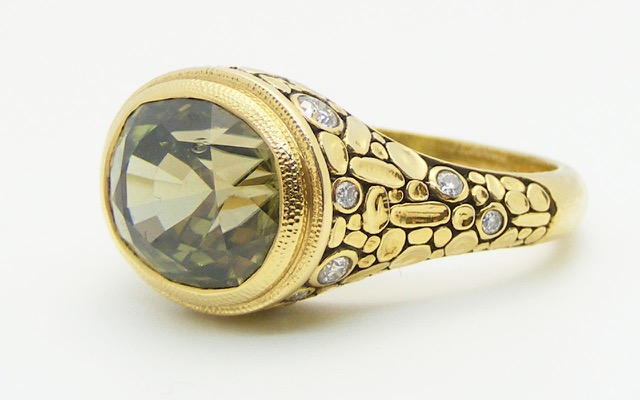 R-171M
“Mosaic” green zircon ring, 18K yellow gold, 6.03 ct Green Zircon center, 16 diamonds totaling 0.10 ct. Available for immediate delivery in finger size 6.75 
$5,425
