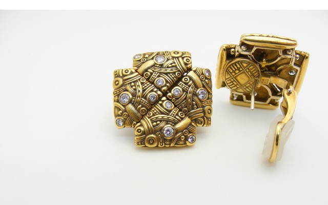 E25 
“Arc” earrings, 18K yellow gold, .56 ctw diamonds. (No longer in catalog)
$12,075
