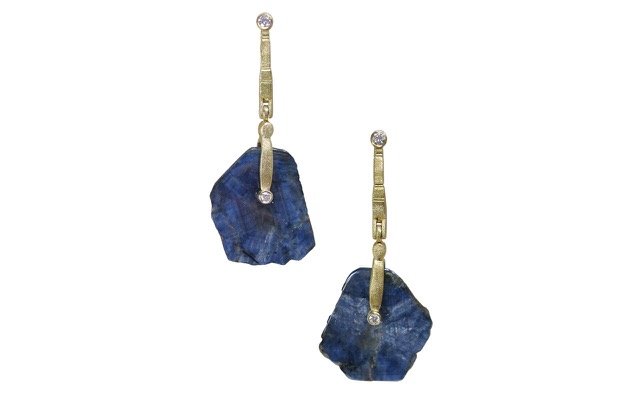 E167MD
“Sticks & Stones”  earrings in 18K yellow gold with blue sapphire slice drops and 4 diamonds totaling 0.17 ct.  These are polished cross-sections of a large blue sapphire crystal that retain the natural shape and rustic surface of the crystal around the edge. The slightly chatoyant patterns in the slices reveal the crystal structure! 23.37 cts total weight.
Immediate delivery
$3,275
