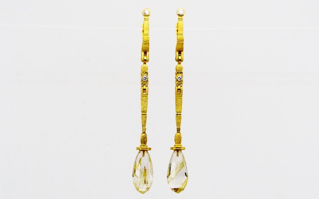E136MD (Sold)
“Sticks and Stones” Rutilated Quartz earrings, 18K Yellow gold, 4 diamonds totaling 0.17 ctw. Rutilated Quartz faceted briolette drops are 9.56 ctw.


