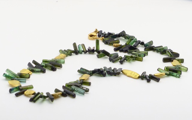 “The Big Sleep” necklace, 18KY, polished natural crystals of Green Tourmaline interspersed with Alex’s compelling face beads.
$4,600.00
