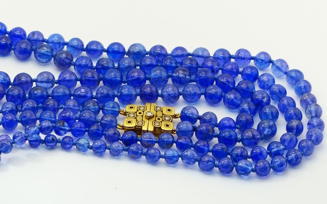 Double-strand Tanzanite bead necklace with 18K yellow gold and diamond clasp. Periwinkle that subtly shifts from royal blue to violet when you look at it from different angles is the hallmark of this amazing African gemstone. Tanzanites total 417 carats and the “Little Windows” clasp (M-71C) contains seven diamonds totaling 0.12 ct.
immediate delivery
 $13,375.00
