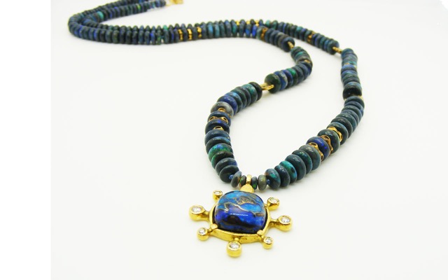R50MD
18K yellow gold “Sticks and Stones” boulder opal pendant with 7 diamonds totaling 0.17ct, on a strand of black opal beads with 20 18K gold accent beads by Alex Sepkus.
$11,350.00
