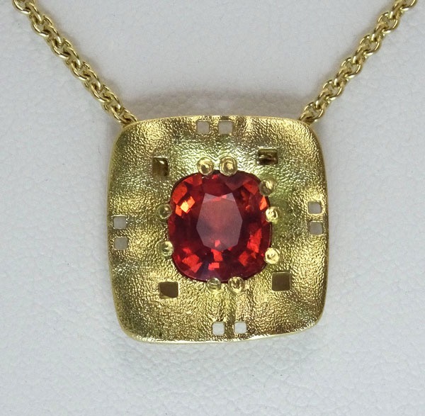 #M-40M 19
“Square Characters” pendant in 18K yellow gold featuring a 2.78 ct coral Sapphire “N”. Includes a 18K yellow gold 18” 1.9mm chain. 
$7,300.00
