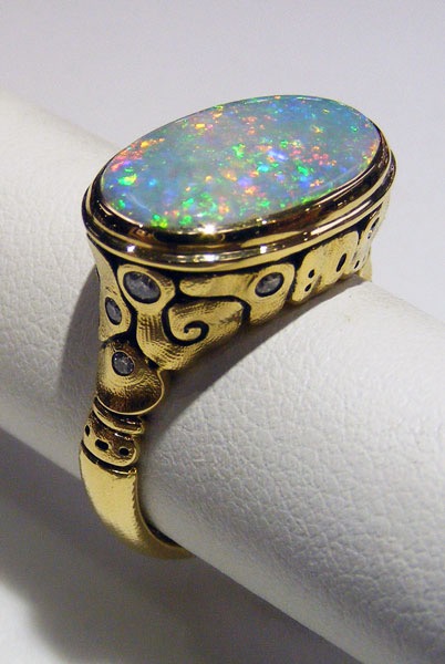 R-194
“Flora” ring in 18K yellow gold with a 2.77 ct Australian Lightning Ridge Pinfire Opal center gemstone and 11 diamonds of 0.15 ct total, in store at Studio Jewelers in a size 6 ¾ 
$7,800
