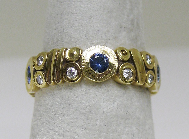 #R-45F
Ring, 18KY, .65ct Blue Sapphires, .25ctw Diamonds, size 7, $5,075.00