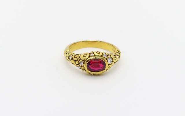 R79M
18K yellow gold ring with a 1.0 ct Red Spinel center gemstone and 9 diamonds of  0.18 ct total (F-G/VVS), in store at Studio Jewelers in a size 6 ½ 
$6,125
