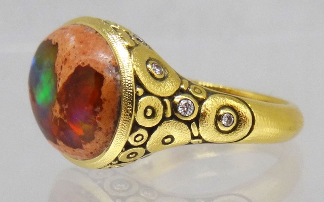 R134 
“Circle Set” ring in 18K yellow gold with a stunning 5.87 ct Mexican boulder opal and 14 diamonds totaling 0.20 ct. Available for immediate delivery in finger size 7.
$5,790
