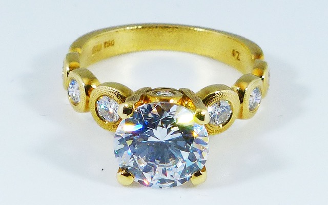 R-193MD 
“Candy” Ring Mounting, 18K yellow gold, Cubic Zirconia center stone (center fits a 8.5-9.5mm  round stone), 10 accent diamonds totaling 0.42ct. Available for immediate delivery in size 5 ¾. 
$4,180 
