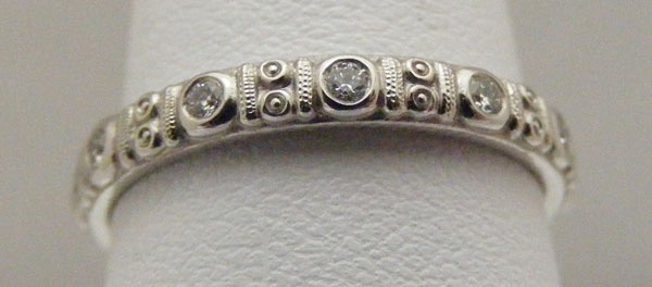 R73P
“Circle”, Platinum, .16 ctw diamonds, 2.5mm wide, in store in size 5 ¾
$3,250
